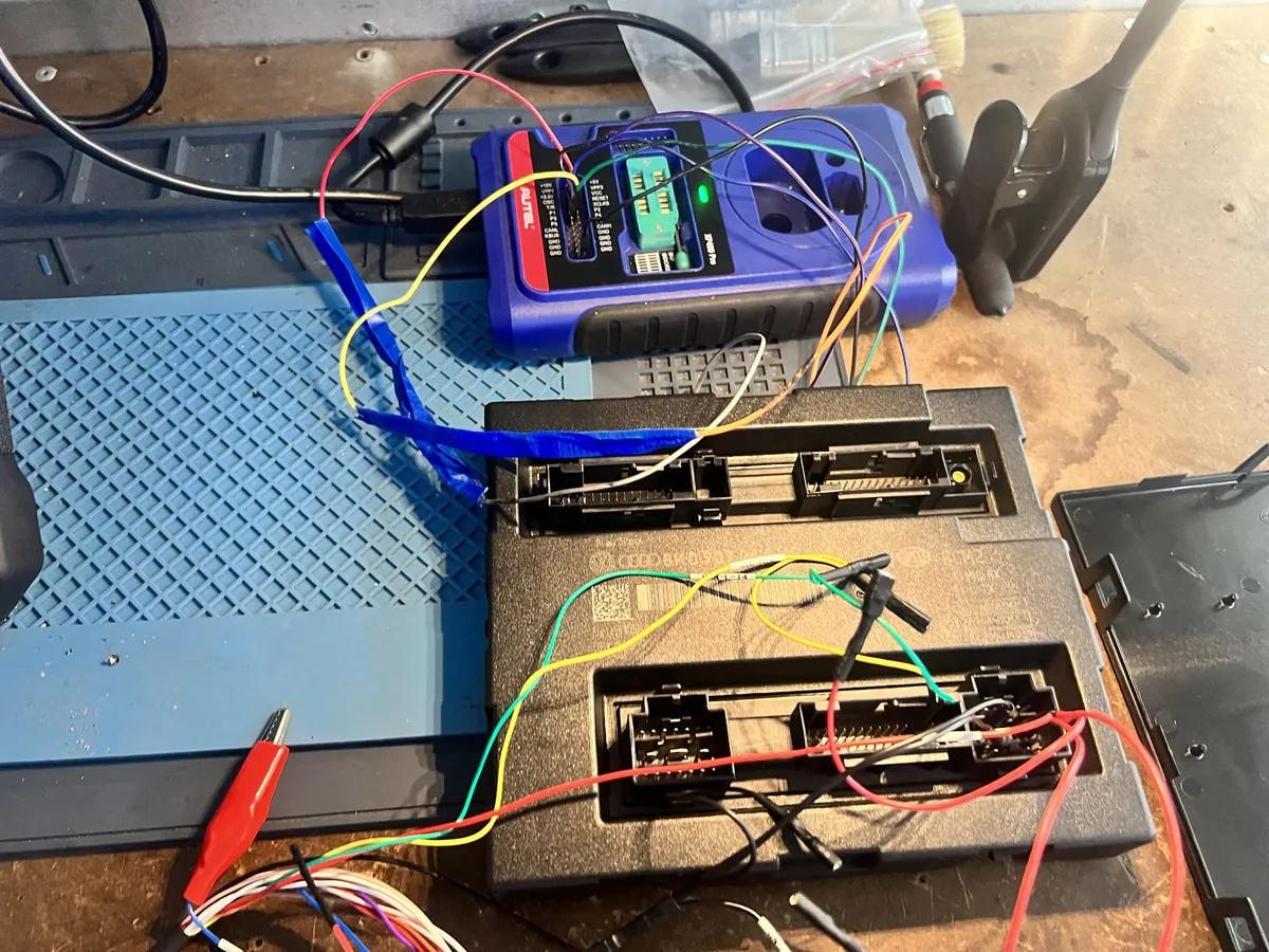 Car control module on the bench connected to a key programmer