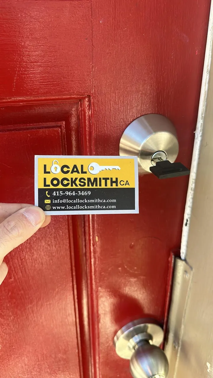 Red front door with a new deadbolt and knob installed