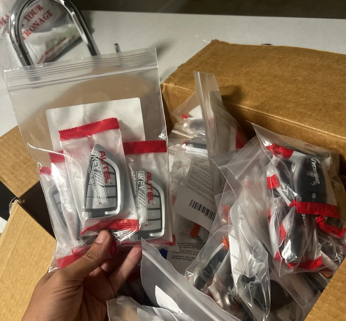 Bags of new universal smart keys in a supply box